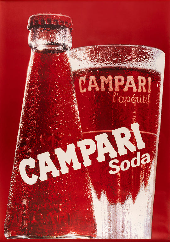 Campari bottle and glass on a red background