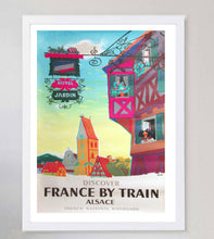 Load image into Gallery viewer, Colorful travel poster for France by train featuring Alsace with a traditional building and 'Hotel Jardin' sign.
