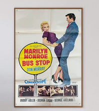 Load image into Gallery viewer, Vintage movie poster for 'Bus Stop' featuring Marilyn Monroe and Don Murray, framed on a white wall.