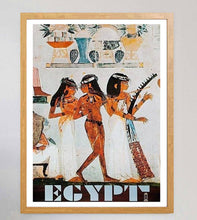 Load image into Gallery viewer, Framed Egyptian art print with three figures, white garments, and hieroglyphic details