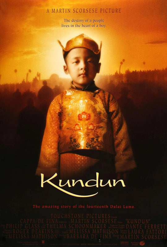 Kundun framed poster with young boy in traditional attire and golden sunset lettering