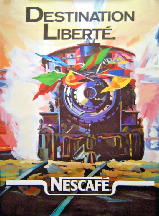Nescaèfe advertisement with a colorful train and 'Destination Libérté' text