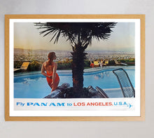 Load image into Gallery viewer, Vintage-style advertisement for Pan Am featuring a person by a pool with a palm tree, set against a cityscape.