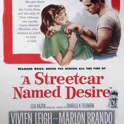 Vintage movie poster for 'A Streetcar Named Desire' featuring Vivien Leigh and Marlon Brando.