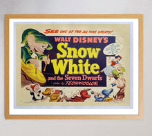 Load image into Gallery viewer, Vintage poster of Walt Disney's 'Snow White and the Seven Dwarfs' with cartoon characters and text.