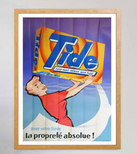 Load image into Gallery viewer, Vintage Tide laundry detergent advertisement with a woman holding a box against a purple curtain.