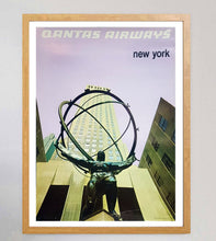 Load image into Gallery viewer, Framed poster of Qantas Airways New York with a statue and building in the background.