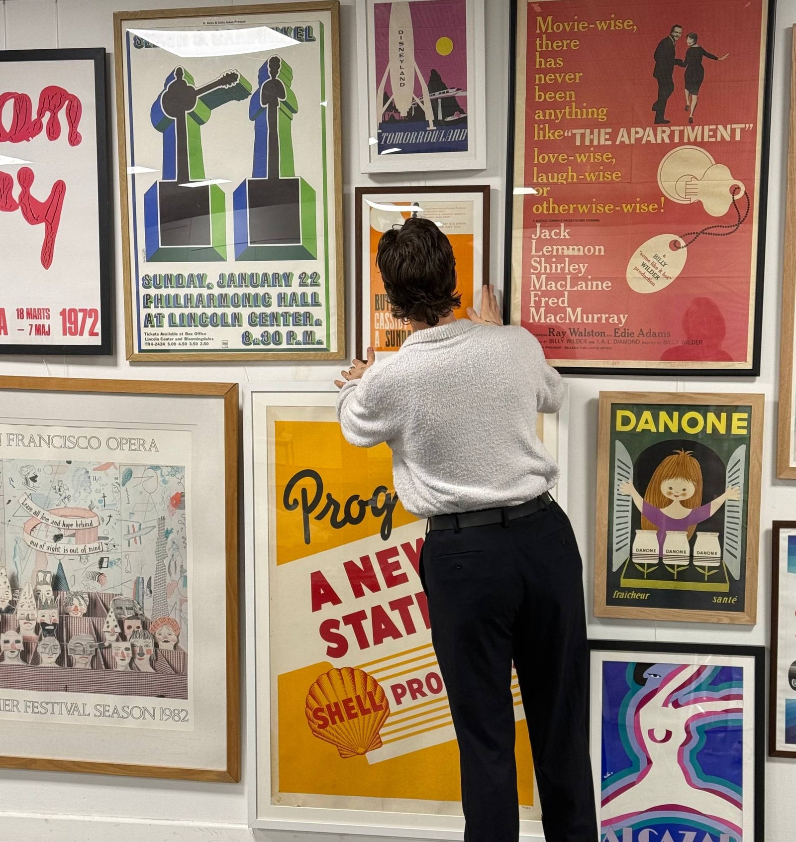 Hanging a newly framed original poster on our gallery wall