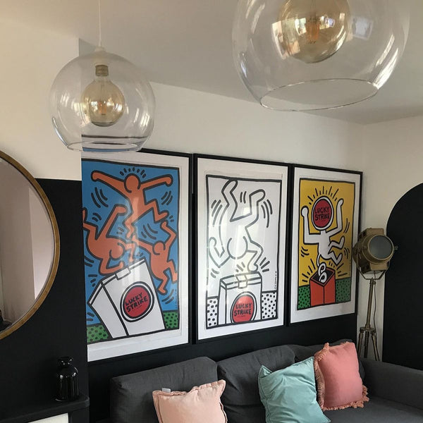 Keith Haring “Lucky Strike” triptych above the sofa