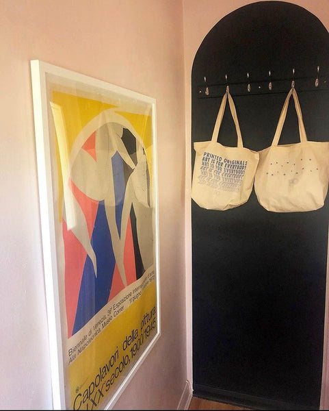“Capolavori della Pittura” print by the coat hooks