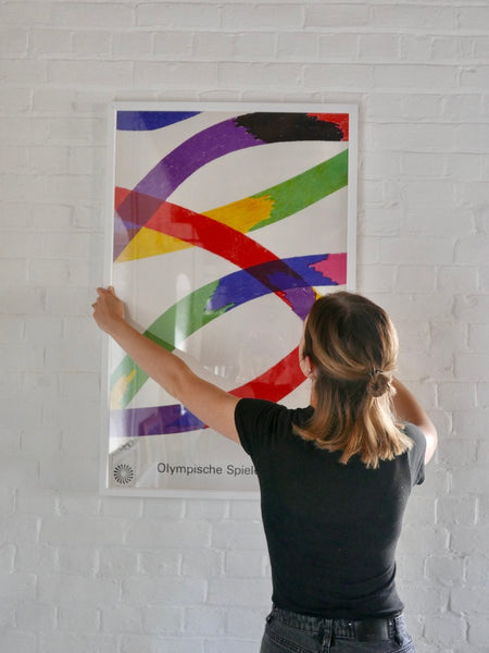 Olympic Games poster, going up on the wall