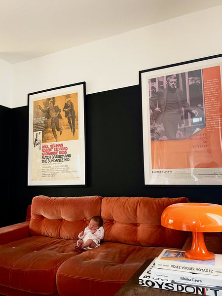 “Butch Cassidy and the Sundance Kid” and “Bullitt” posters above the sofa