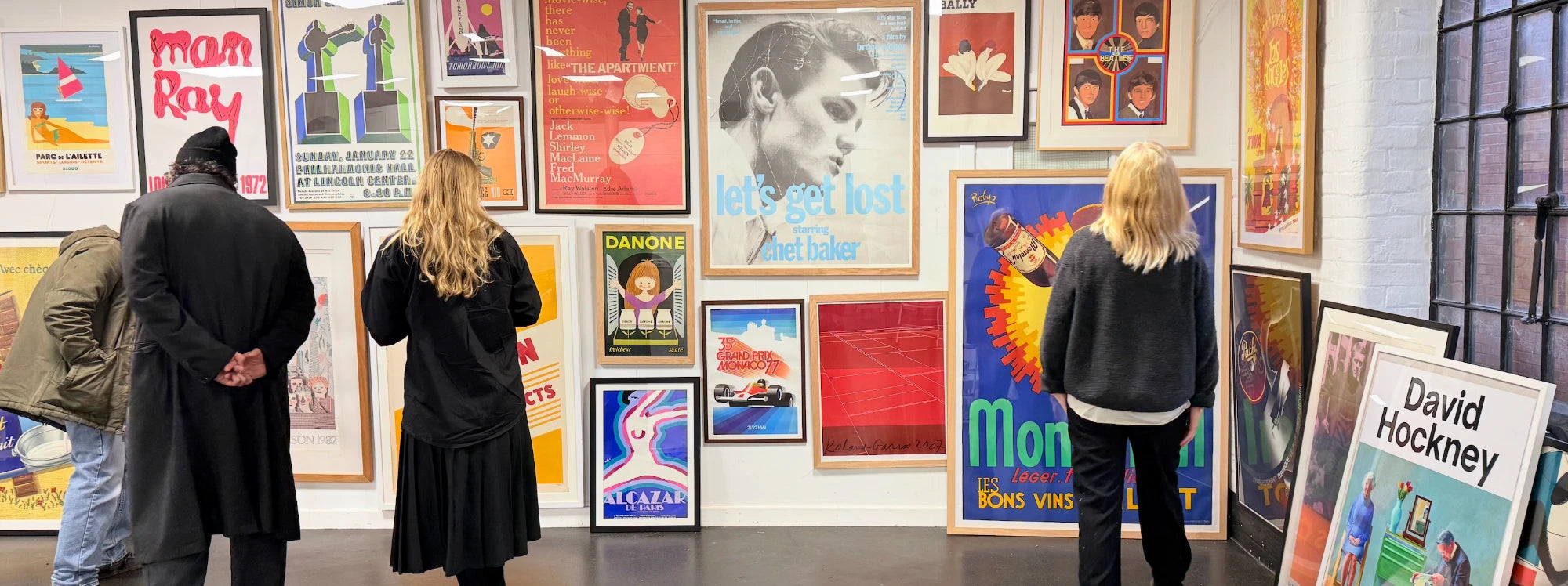A wall of conservation framed original vintage posters at Printed Originals