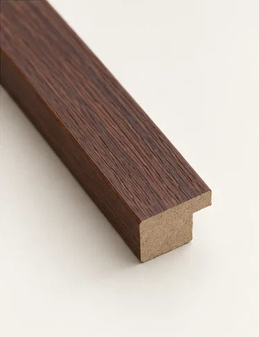 Cut section of the walnut moulding, showing the rebate at the back of the frame
