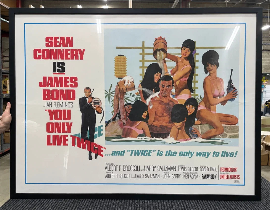 The same You Only Live Twice quad after framing, mounted and glazed in a black moulding