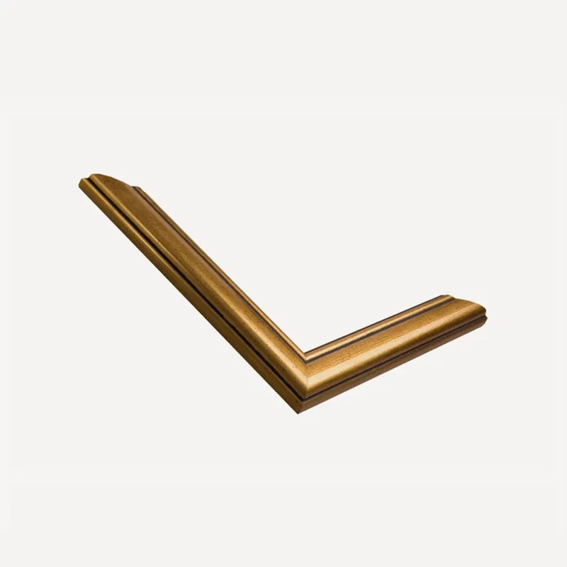 Mitred corner of our antique gold moulding, a burnished gold with fine incised lines