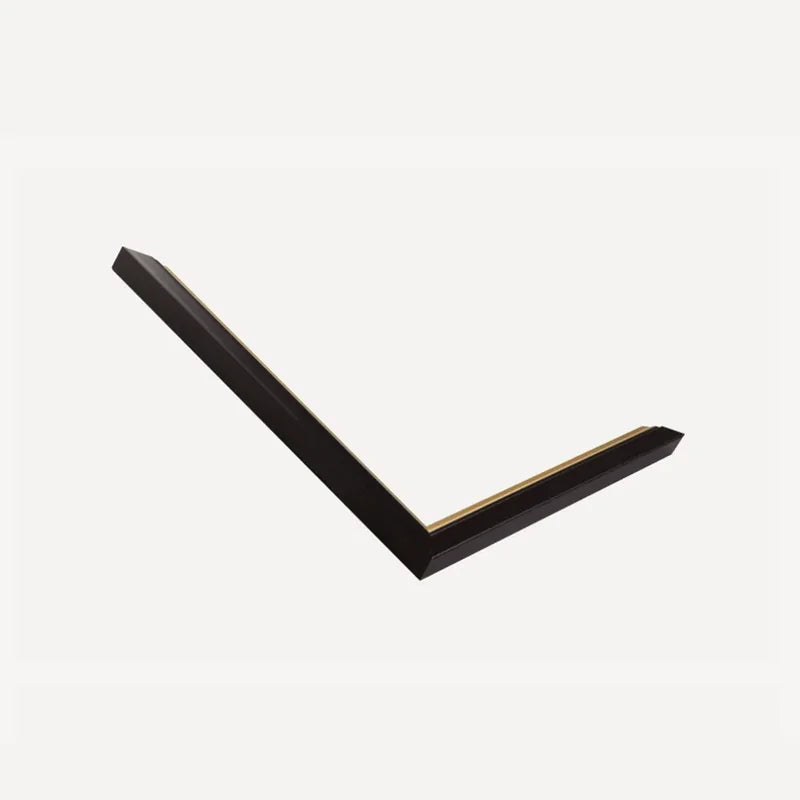 Mitred corner of our black moulding with a fine gold inner line