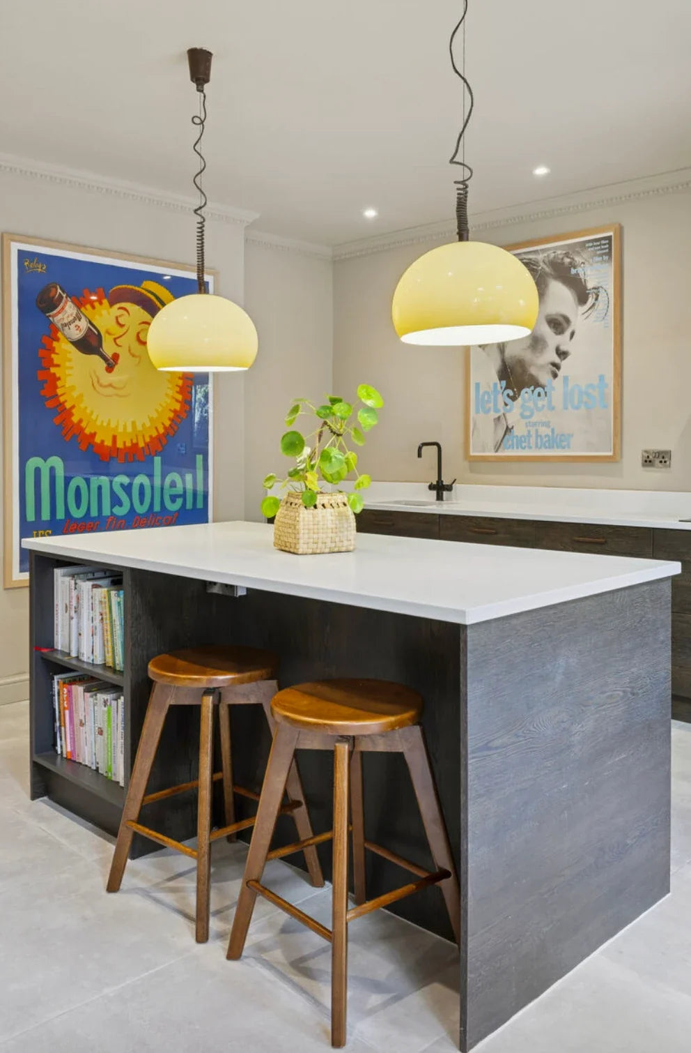 Original Monsoleil and Chet Baker posters framed in a kitchen