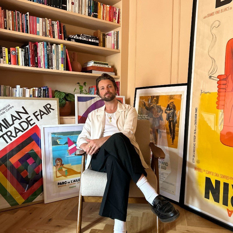 A member of the Printed Originals team at home, surrounded by original posters