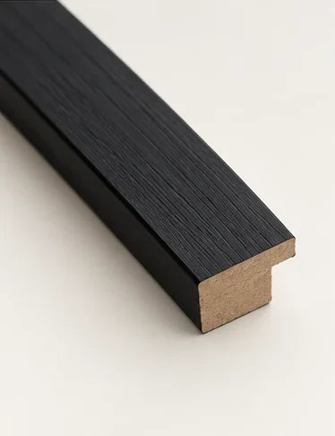 Cut section of the black moulding, showing the rebate at the back of the frame
