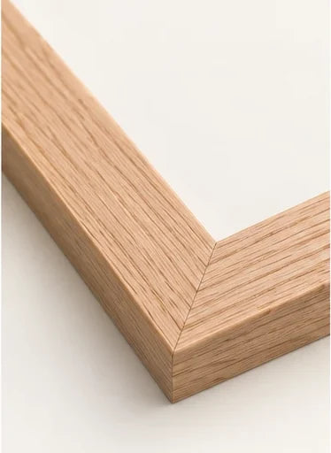 Mitred corner of our natural oak moulding, showing the open oak grain
