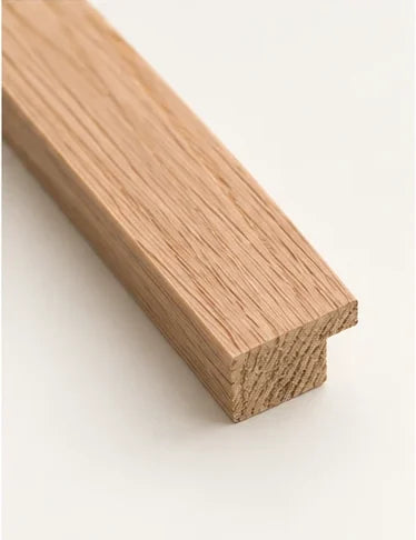Cut section of the natural oak moulding, showing the rebate at the back of the frame