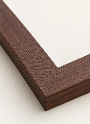 Mitred corner of our walnut moulding, a deep red-brown with open grain