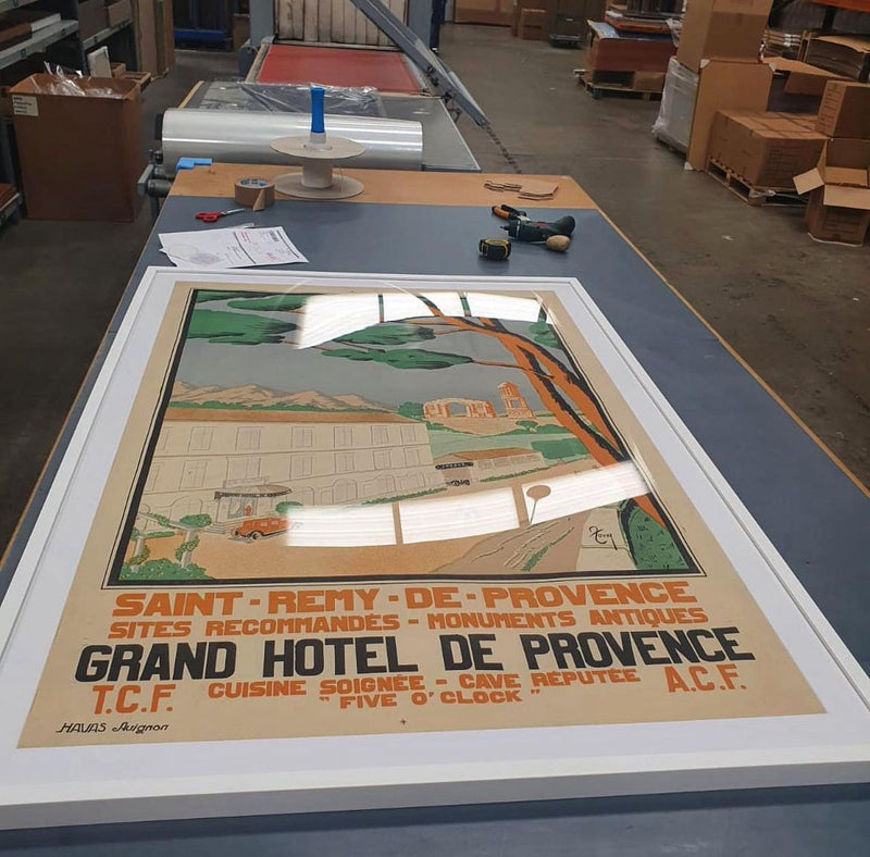 A poster being packed for shipping